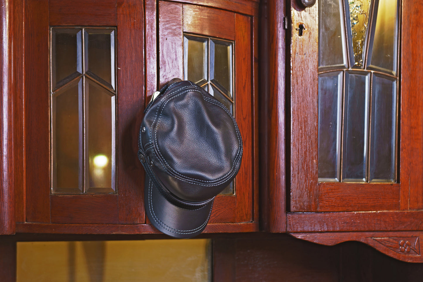 Classic Black Leather Biker Cap with Metal Eyelet and Lace-Up Detailing